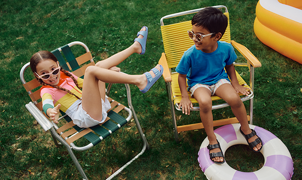 Kids in beach chairs wearing Birkenstock EVA sandals
