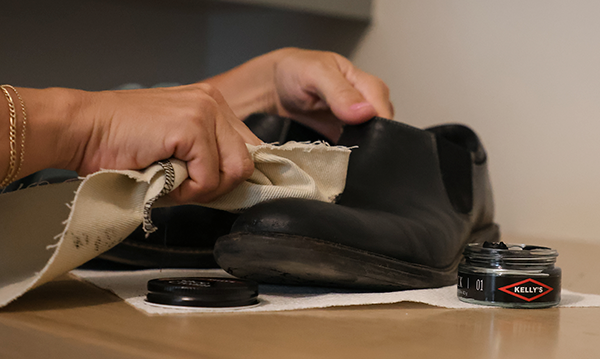 A pair of men's dress shoes being polished