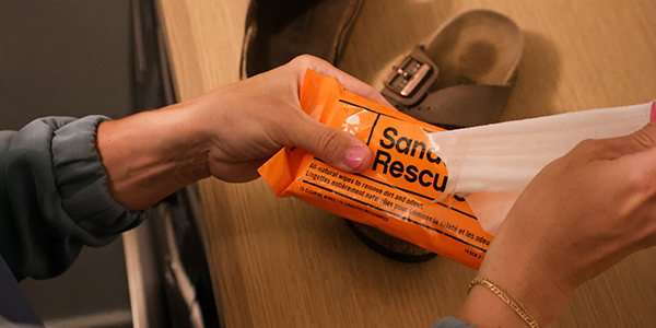 A pair of Birkenstocks being cleaned with sandal rescue wipes