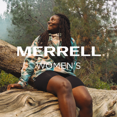 Woman sitting on log