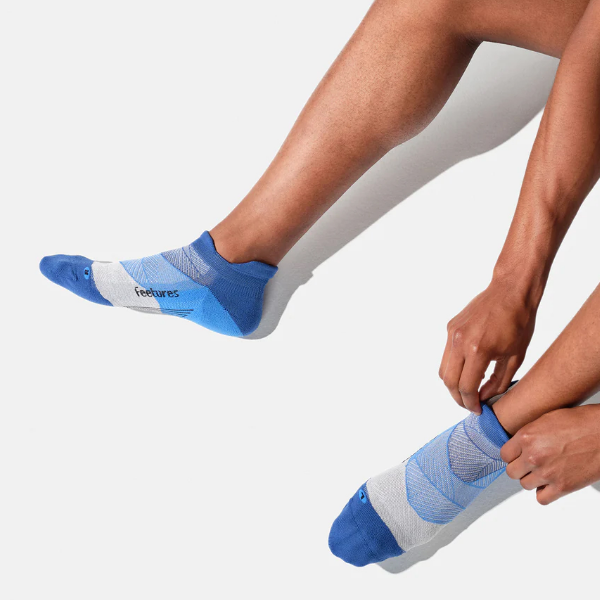 Man putting on socks