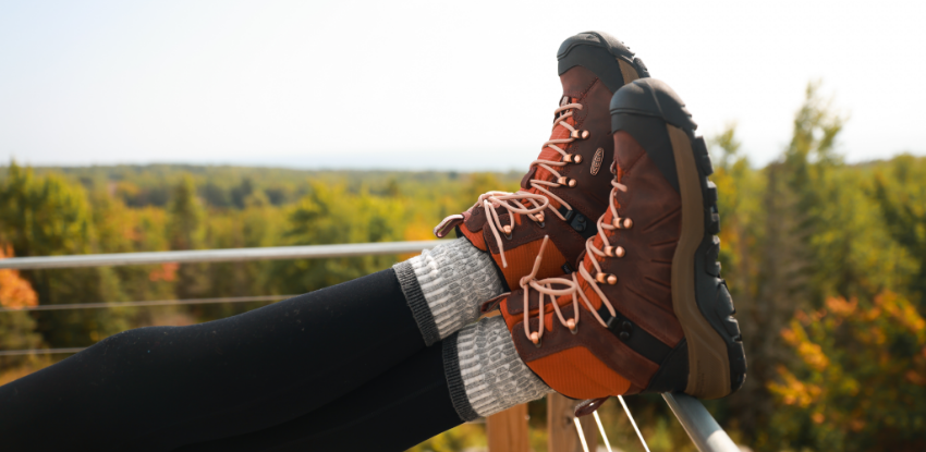 Woman resting feet on railing