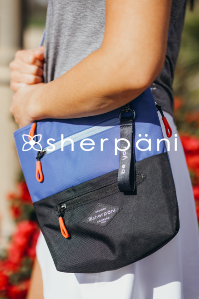 Woman holding crossbody bag