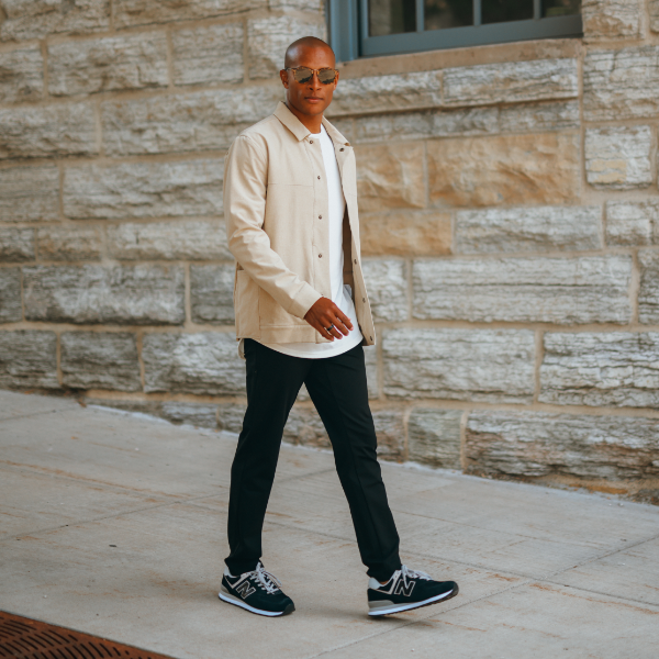 Man walking down sidewalk
