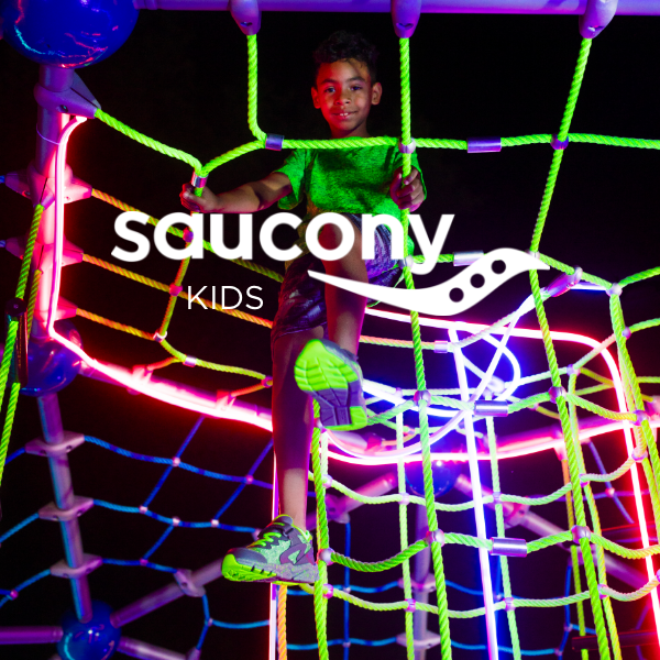 Kid climbing on glow in the dark playground