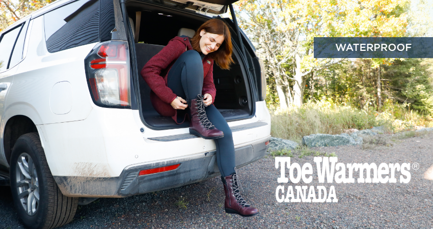 Woman putting boot on in the back of the car