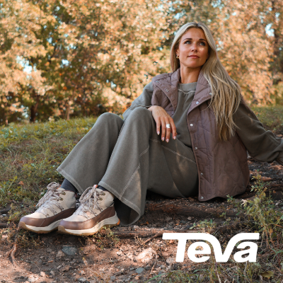Woman sitting on ground in Teva Auroris Ankle boots