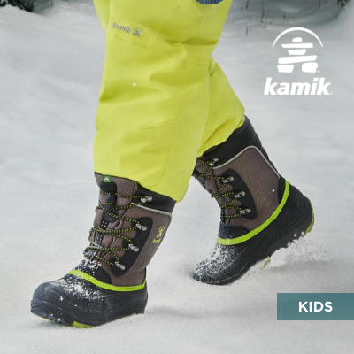 Kid walking through snow in Kamik boots