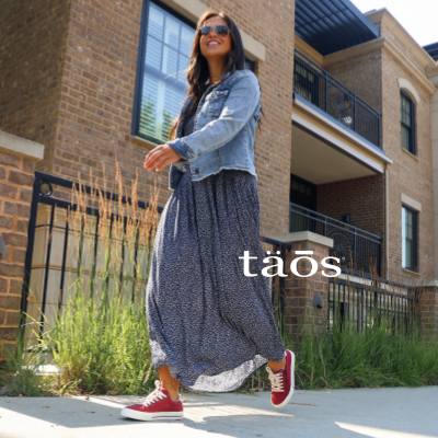 Woman walking on sidewalk