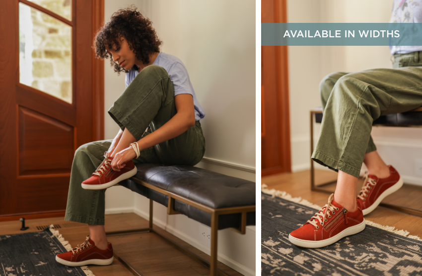 Woman zipping up shoe