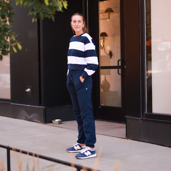 Woman standing on sidewalk