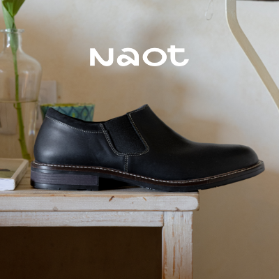 Naot Director dress shoe sitting on table 