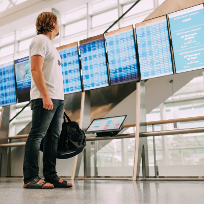 Man looking at flightboard 