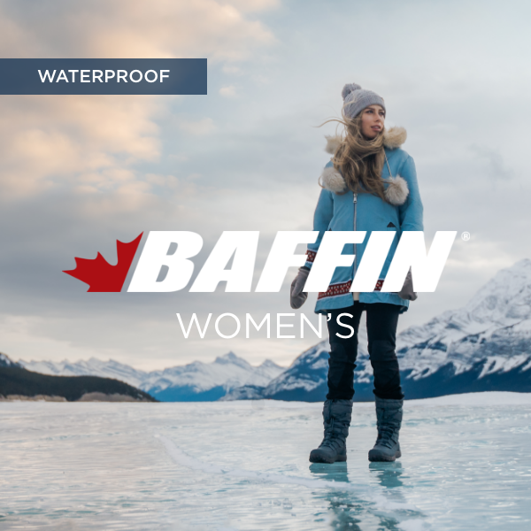 Women standing on frozen lake
