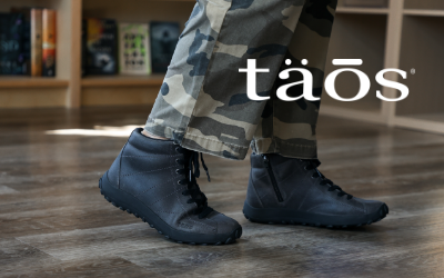 Woman standing in bookstore in Taos Trail Mix boots