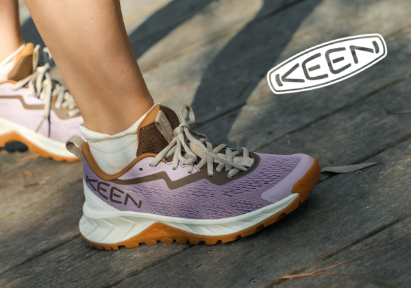 Woman walking across bridge in Keen shoes