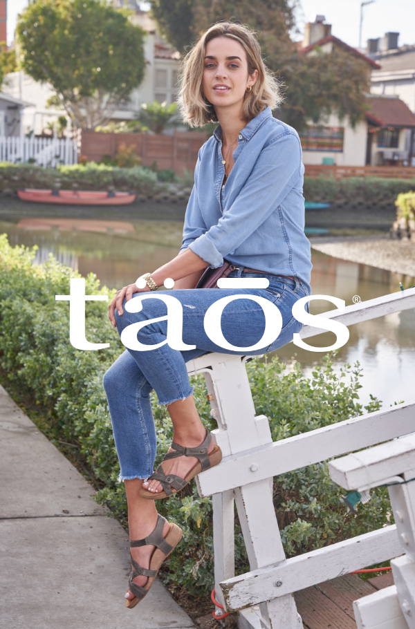 Woman sitting on bridge walkway