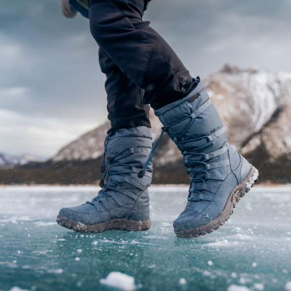Woman standing on frozen lake