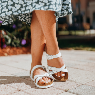 Woman posing on sidewalk