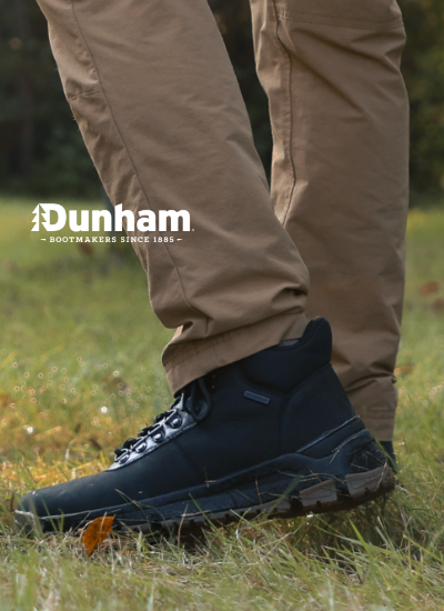 Man raking leaves in Dunham boots