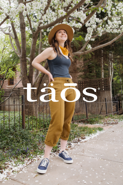 Woman standing on sidewalk posing
