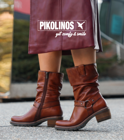 Woman standing on sidewalk posing in Pikolinos San Sebastian 9590c1 boots