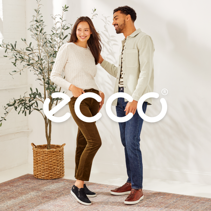 Man and woman smiling in studio