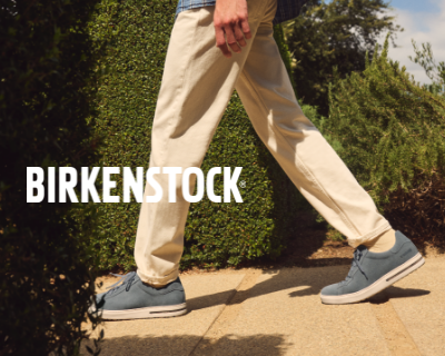 Man walking through garden in Birkenstock Bend sneakers