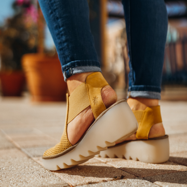 Woman posing on sidewalk