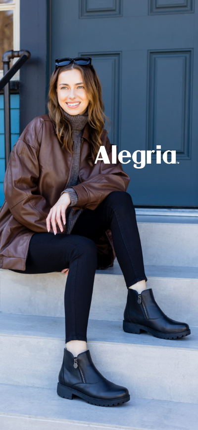 Woman sitting on stairs in Alegria Rorie boots
