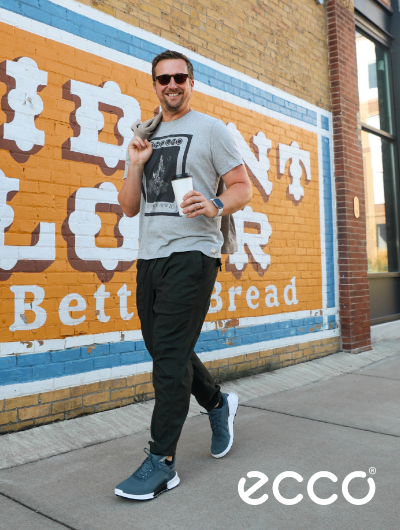 Man walking down street in Ecco Biom 2.1 X Mtn Sneakers