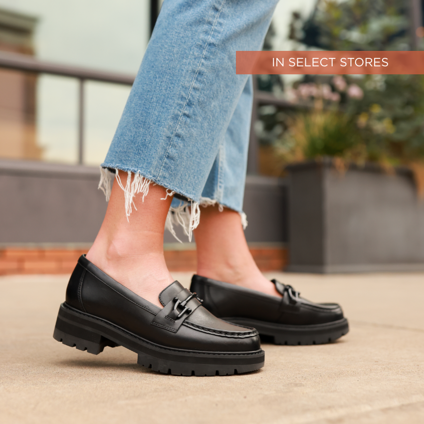 Woman standing on sidewalk