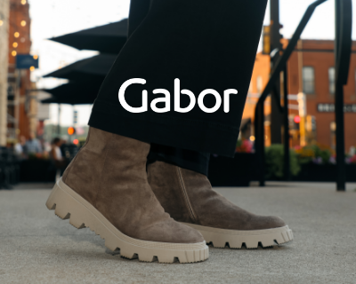 Woman standing on sidewalk posing in Gabor Sara 820 boots