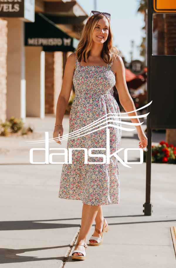 Woman walking on sidewalk 