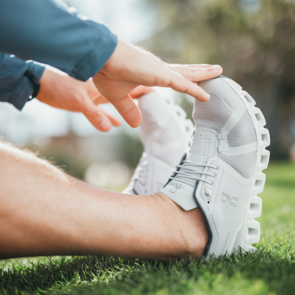 Man stretching, touching his toes