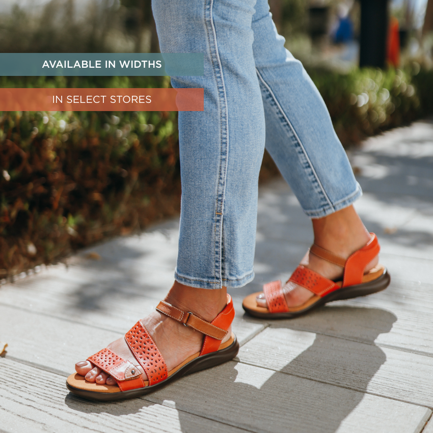 Woman standing on sidewalk