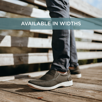 Man standing on bridge 