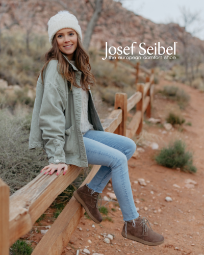 Woman sitting on wood railing in Josef Seibel Anna 08 boots 
