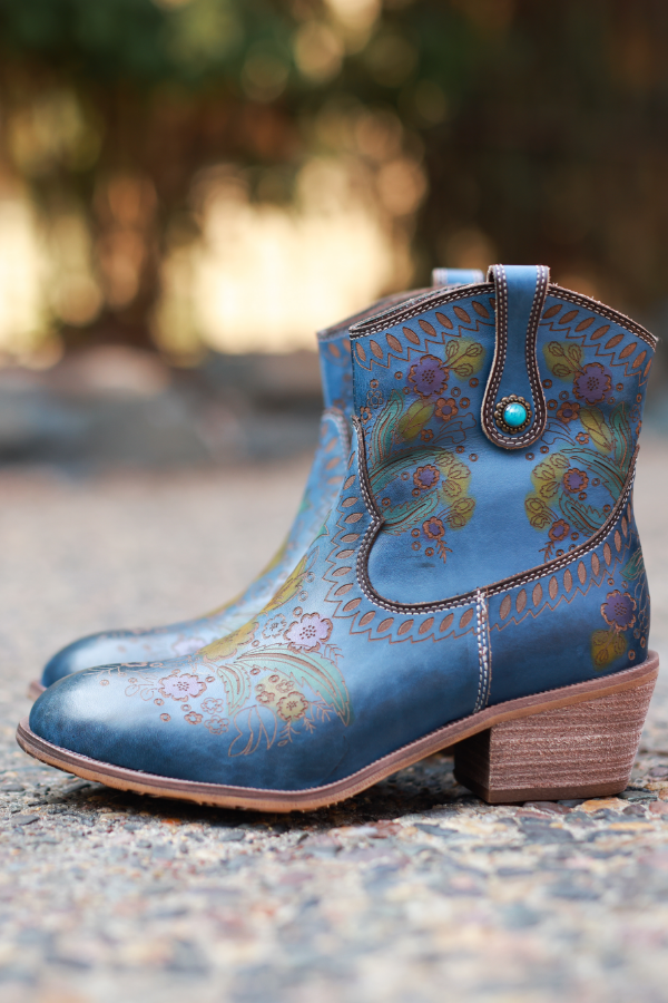 Boots sitting on sidewalk