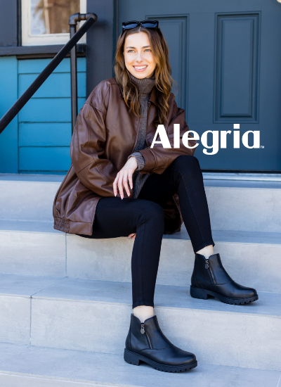 Woman sitting on stairs in Alegria Rorie boots