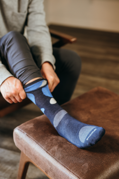 Man putting sock on 