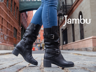 Woman walking across cobblestone in Jambu Victoria boots