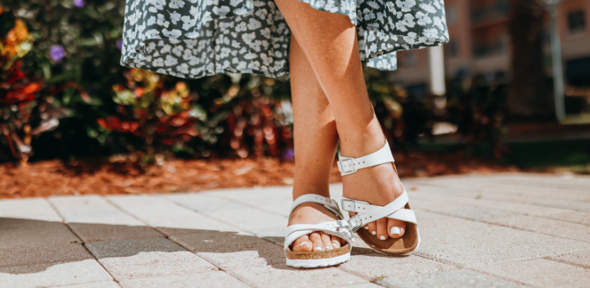 Woman standing on sidewalk