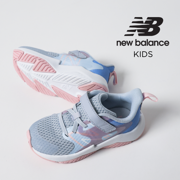 Kids New Balance shoes sitting on white backdrop