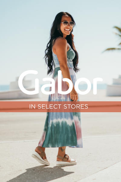 Woman posing on sidewalk