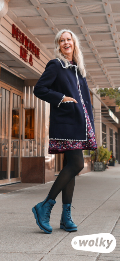 Woman standing on sidewalk posing in Wolky Akita boots