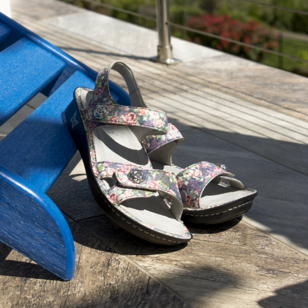 Shoes sitting on sidewalk