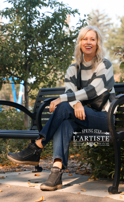 Woman sitting on park bench wearing Spring Step boots