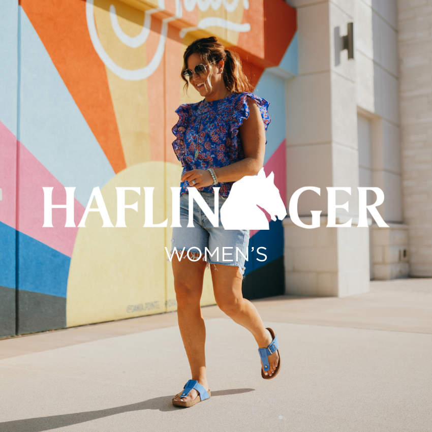 Woman walking on sidewalk
