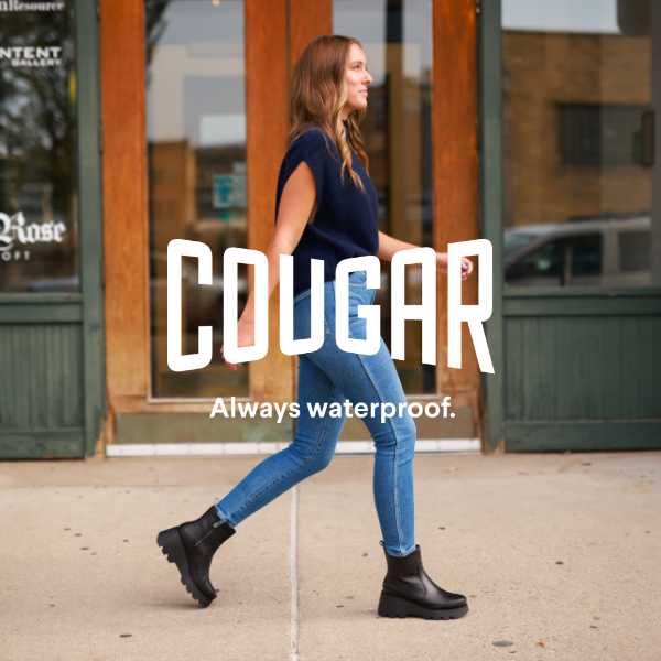 Woman walking in front of storefront